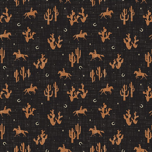 Fabric with desert-themed pattern including horses, cacti, and mountains on a black background.